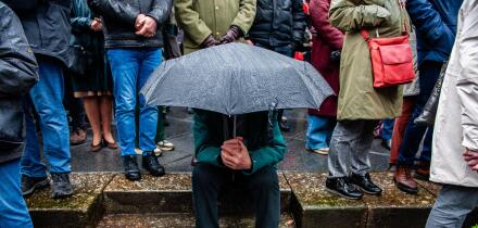Nijmegen, Netherlands. 22nd Feb, 2024. A man shelters underneath an umbrella during the event. The 80th commemoration of the Bombing of Nijmegen which was unplanned attack by American aircraft on the city of Nijmegen, on 22 February 1944. Every February 2