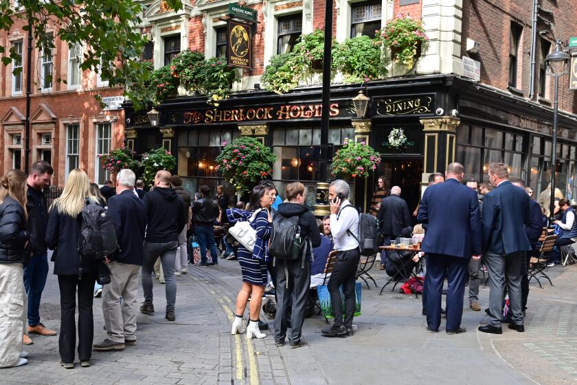 State funeral of Her Majesty Queen Elizabeth II, London, UK, Monday 19th September 2022. Drinkers in The Sherlock Holmes pub after the event.