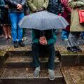 Nijmegen, Netherlands. 22nd Feb, 2024. A man shelters underneath an umbrella during the event. The 80th commemoration of the Bombing of Nijmegen which was unplanned attack by American aircraft on the city of Nijmegen, on 22 February 1944. Every February 2