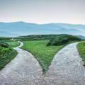 landscape of a fork in the road at storm weather, concept of insecurity of future