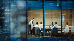 Corporate business people meeting in highrise conference room