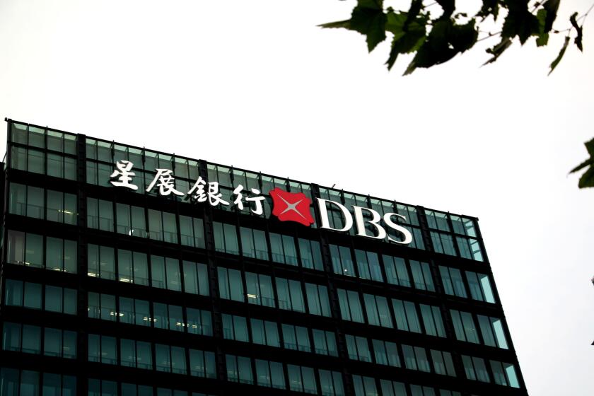 --FILE--A logo of DBS Bank, Singapore's largest lender, is pictured on a rooftop of a building in Shanghai, China, 29 August 2017.

DBS Bank, Singapo