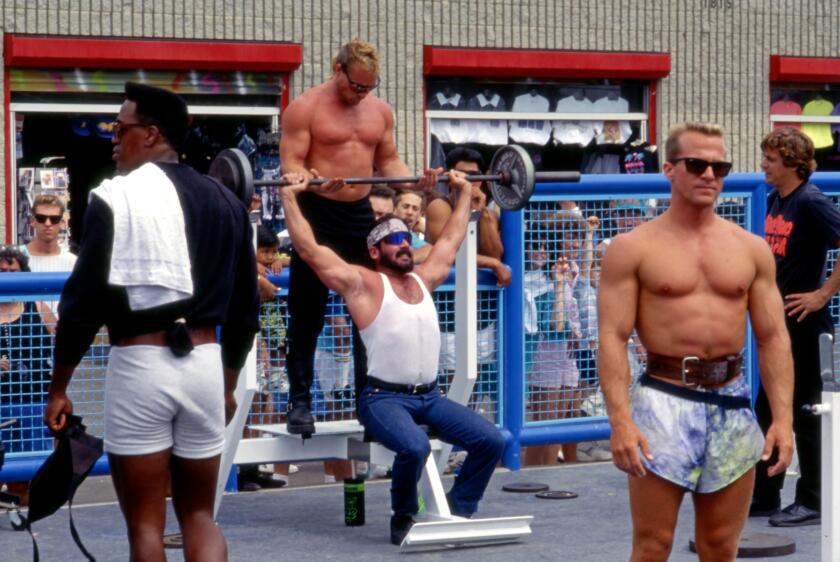 Men lifting weights at Muscle Bach in Venice Beach, CA