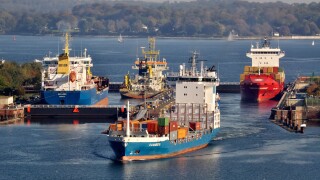 Shipping container ships at Holtenau lock, Kiel Canal, Kiel, Schleswig-Holstein, Germany, Europe