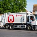 Veolia waste management vehicle, truck, lorry or dust cart on a road in England, UK.