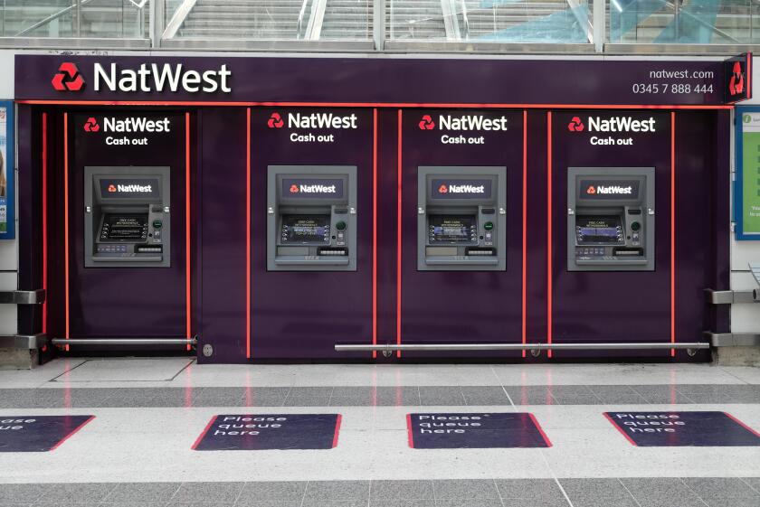 A row of NatWest bank ATMs on the concourse at Liverpool Street Station in The City of London England UK  KATHY DEWITT