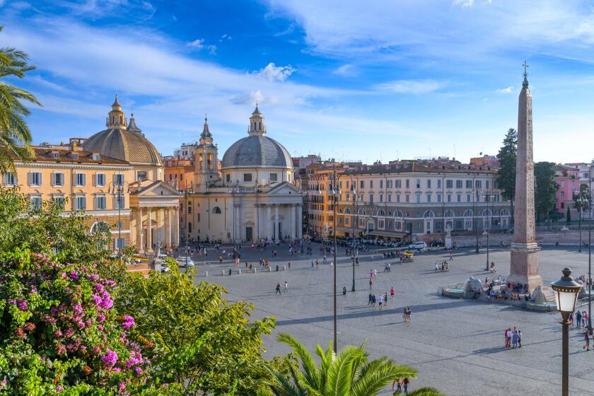 View of Piazza del Popolo (People's Square) in Rome, Italy. Skyline over Rome: Churches of Santa Maria in Montesanto and Santa Maria dei Miracoli.