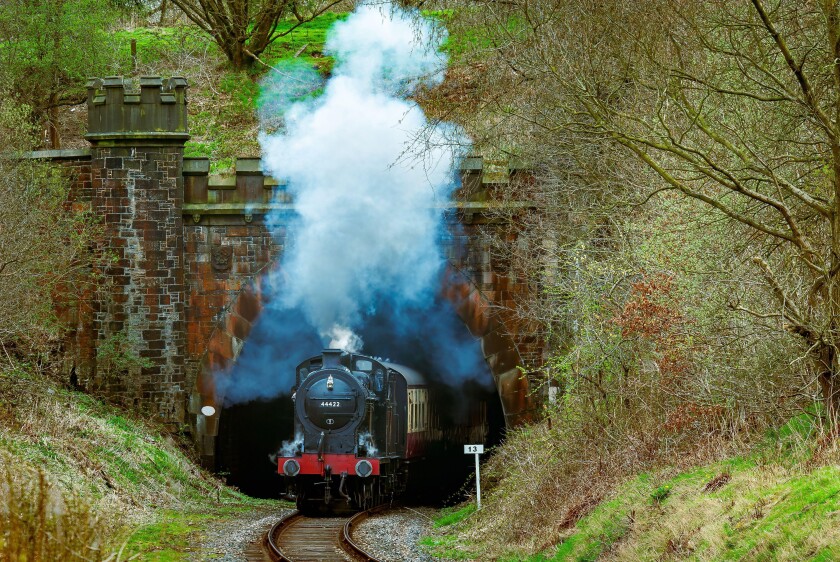 LMS 0-6-0 4F locomotive seen steaming from the Nuttall Park tunnel on the East Lancashire heritage railway towards Ramsbottom.