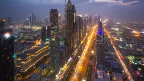 Skyscrapers along Sheikh Zayed Road at evening rush hour, Dubai, UAE