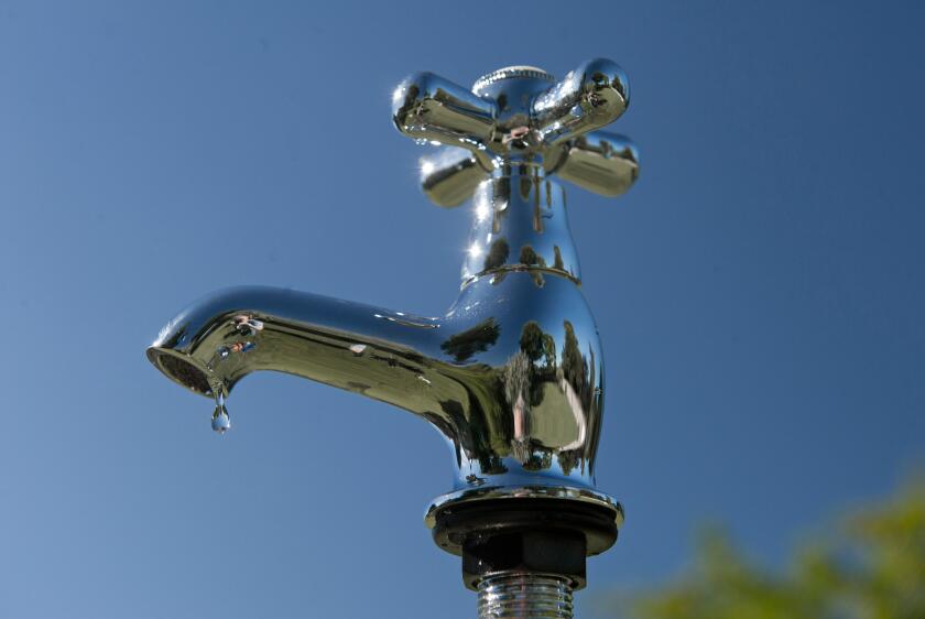 Fresh drinking water dripping and pouring from a tap