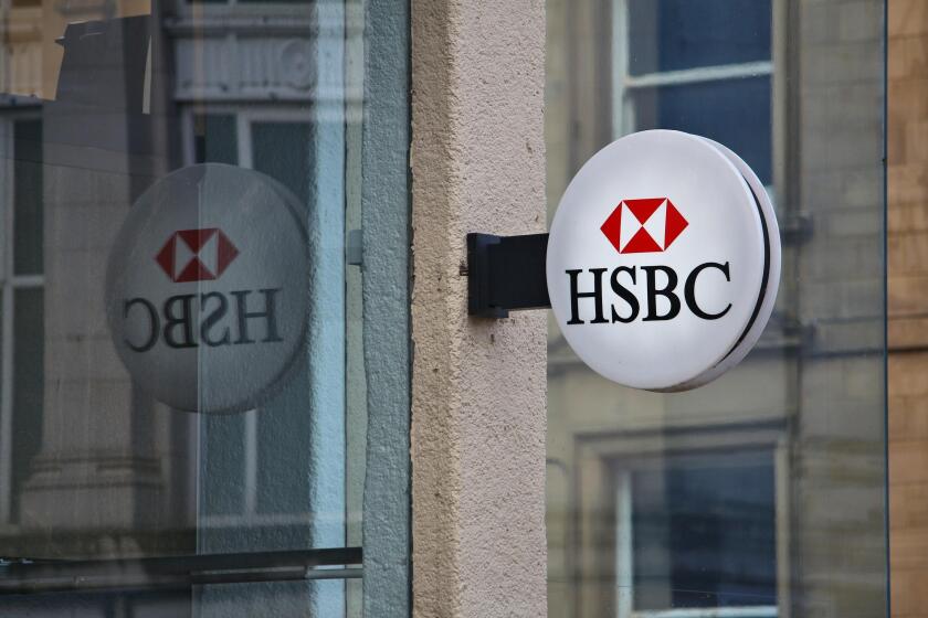 HUDDERSFIELD, UK - JULY 10, 2016: HSBC bank branch in Huddersfield, UK. HSBC is one of largest bank groups, holding assets of USD 2.69 trillion worldw