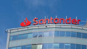 Close up of Santander Bank logo and sign on the office building in Warsaw, Poland.