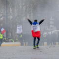 26.01.2019, Paris, Paris, France - Demonstrator with a French flag runs across the empty Place de la Bastille. 0MK190126D035CAROEX.JPG [MODEL RELEASE: