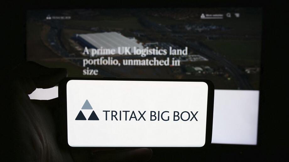 Stuttgart, Germany, 05-29-2024: Person holding cellphone with logo of British property company Tritax Big Box REIT plc in front of business webpage. F