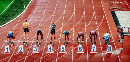 OSTRAVA, CZECHIA, MAY 28, 2024: Elite Sprinters at the 100-Meter Starting Line. Track and Field Sport Photo. Back View. Pre race before summer olympic