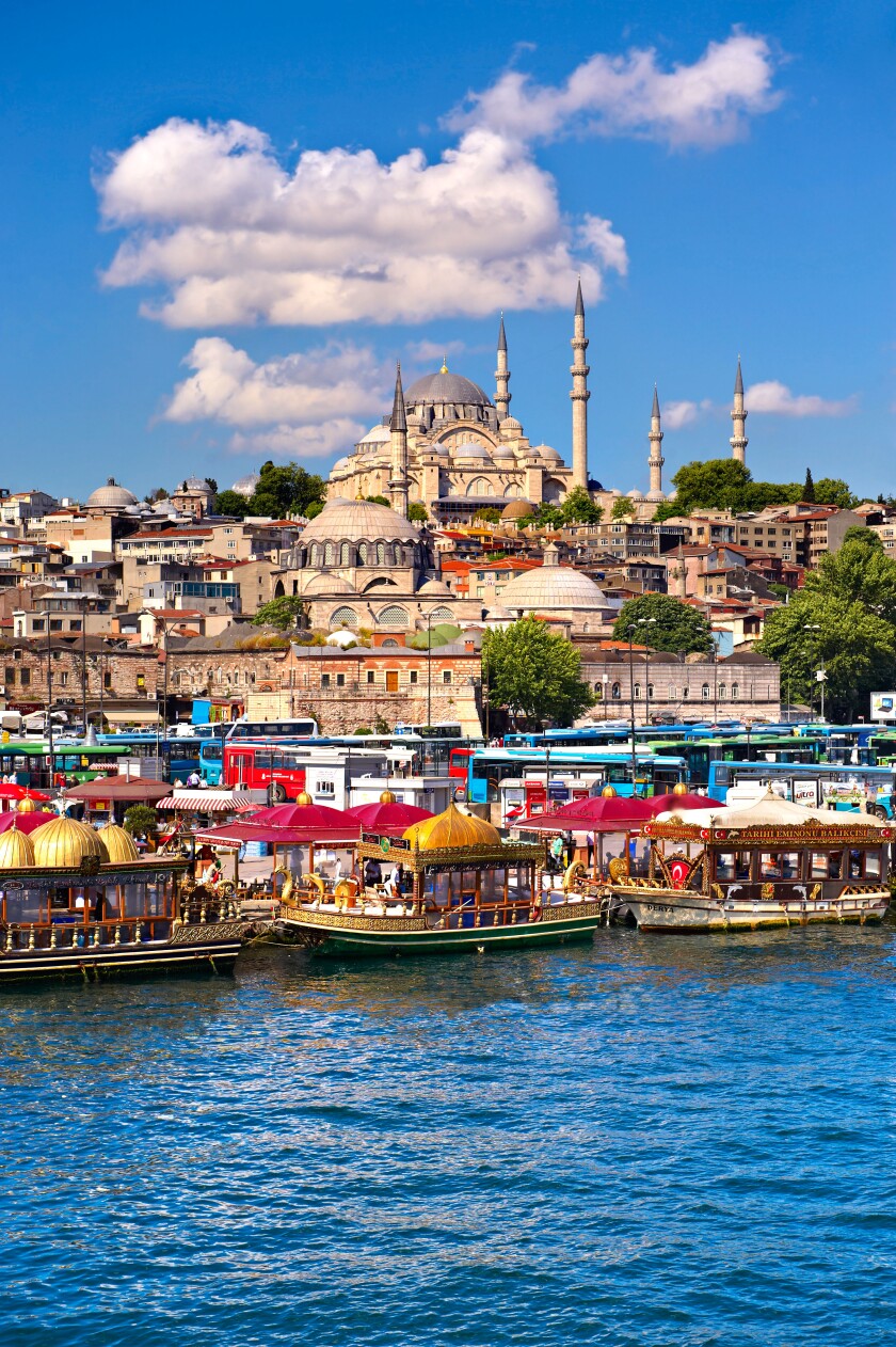 The Suleymaniye Mosque  on the Third Hill with a ferries on the banks of the Golden Horn, Istanbul Turkey