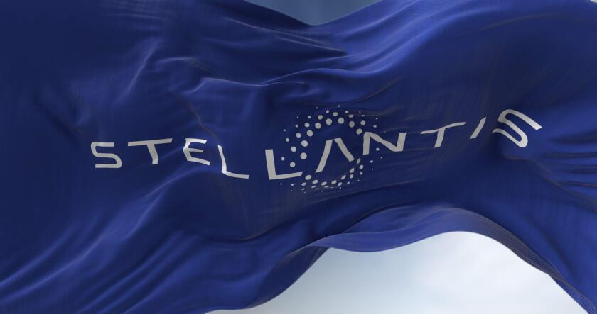 Amsterdam, Holland, March 2022: Close-up view of the blue flag with the Stellantis logo waving in the wind. Stellantis is a Dutch multinational motor