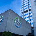 Bayer AG company logos displayed on the exterior of the division pharmaceuticals headquarters building in the Wedding district of Berlin, Germany.