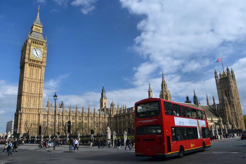 Red double-decker bus in front of the British Parliament, London, England, United Kingdom, Europe