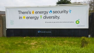 ClearChannel advertising billboard for BP on hoarding in Newport South Wales UK
