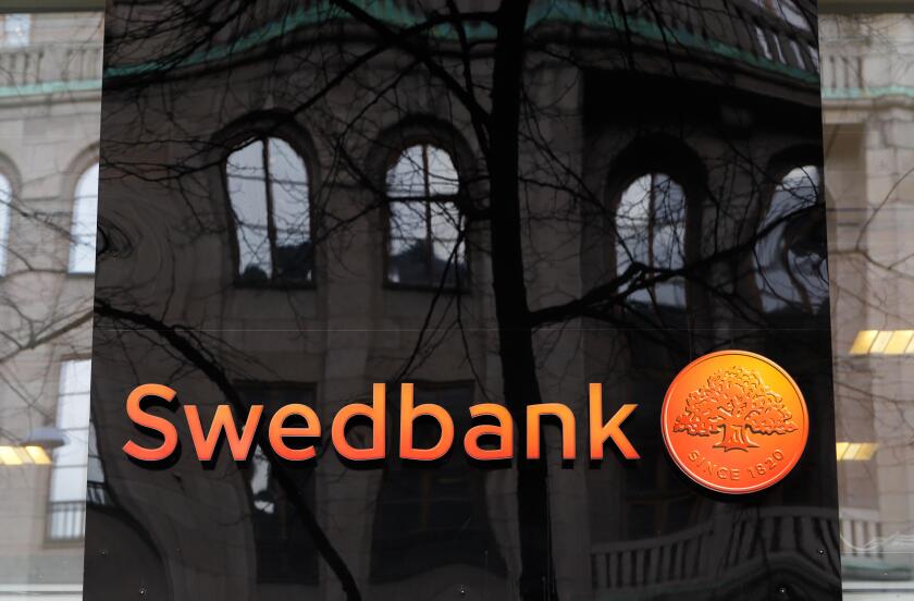 Stockholm, Sweden - April 2, 2015: Reflections at the Swedish bank Swedbank office exterior at Hamngatan.