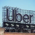 Manhattan, NY - April 9, 2023: New York City Uber car service billboard on top of building