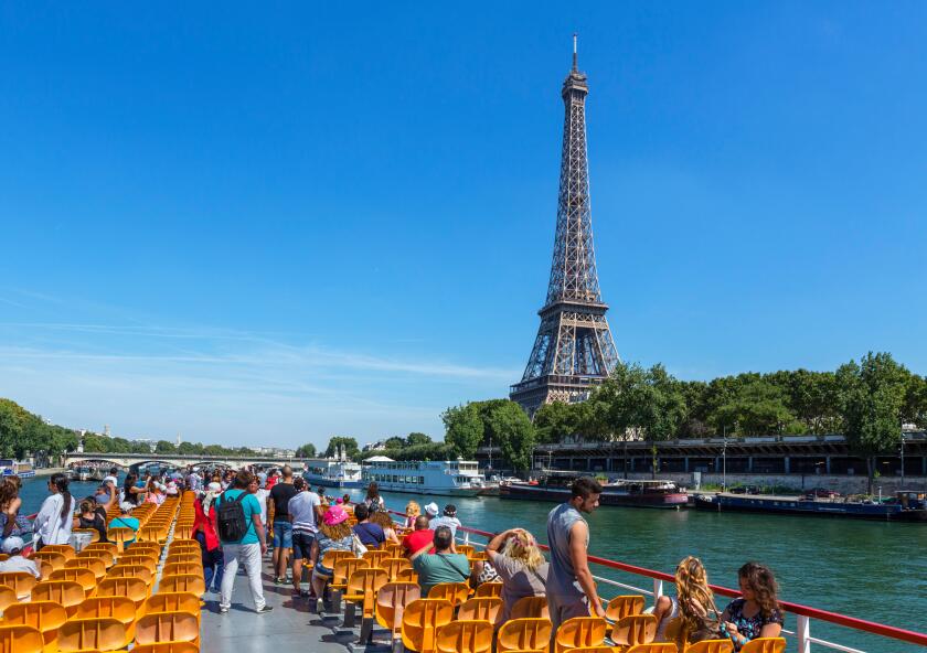 View of the Eiffel Tower from a Bateau Mouche on the River Seine, Paris, France