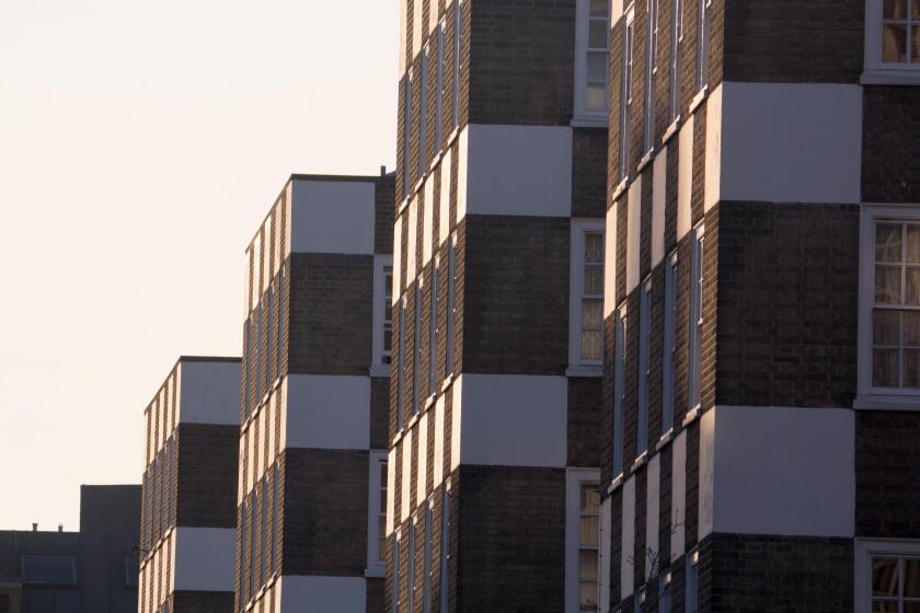 Distinctive tower blocks of flats apartments with checkerboard facade front frontage Grosvenor Estate Page Street Pimlico London