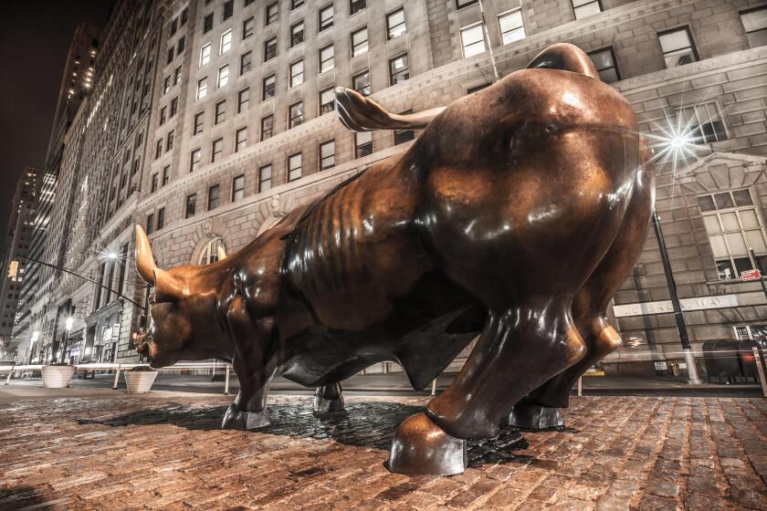 Wall street bull at night