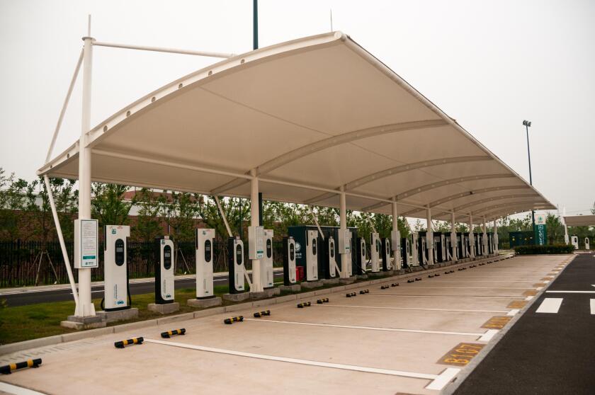 Parking spots at an EV charging station, number 4 car park Shanghai Disneyland, China.
