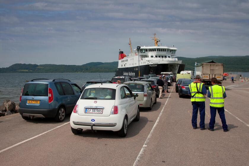 cars being loaded onto Caledoniann MacBrayne vessel 'MV Finlaggan' at Kennicraig Pier, West Loch Tarbert.