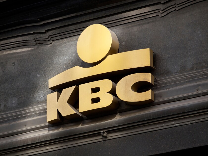 Gold KBC Bank logo on facade in Brussels, Belgium