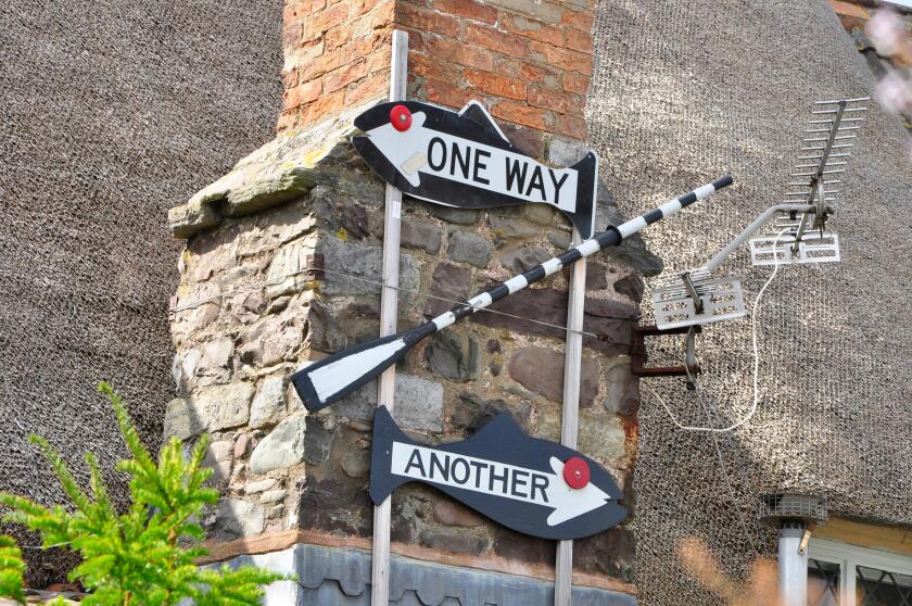 Sign on cottage in Porlock Weir, Somerset, one way oar another.