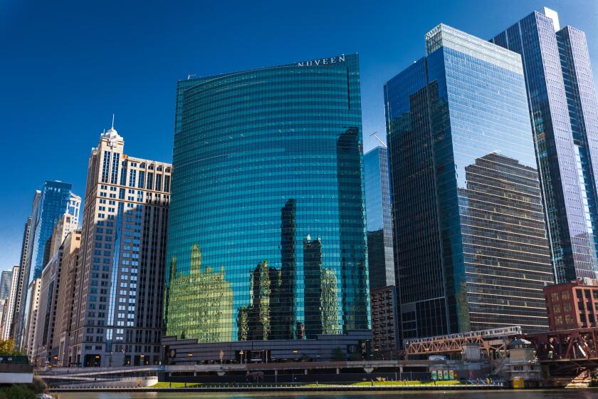 CHICAGO, IL, USA - November 8, 2017: Chicago Skyline West Wacker Drive as seen from the river cruise. Nuveen Building.