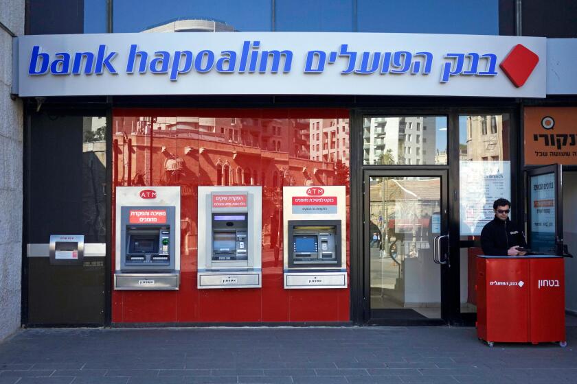 ISRAEL - JERUSALEM 18 February. Security man at guard at the entrance to Bank Hapoalim in Jerusalem on 18 February 2014. Deutsche Bank includes Israeli bank on a list of companies whose conduct is ethically questionable, possibly due to its activity in th