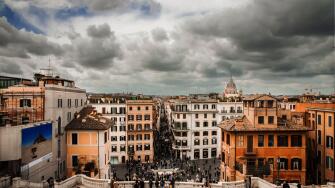 Panorama of Rome photographed from the upper part of the Spanish Steps. In the centre, the famous shopping street: Via Condotti