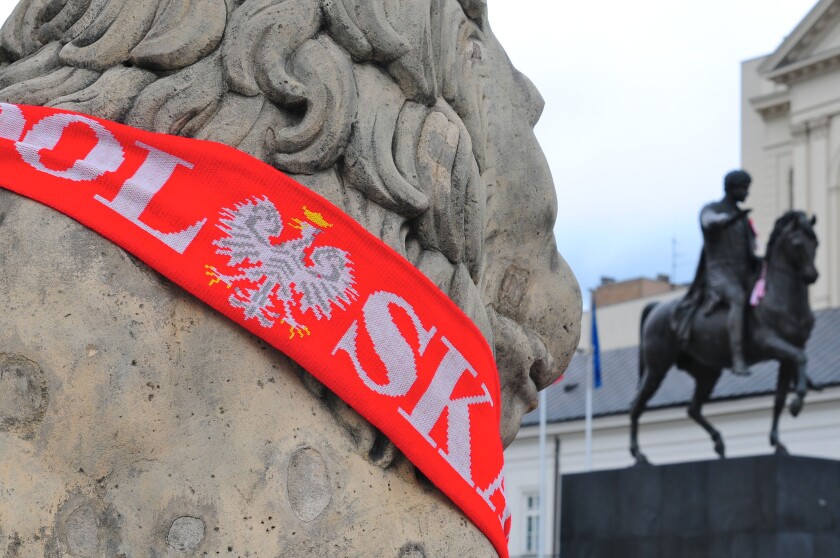 Poland scarf on a statue in Warsaw at Euro 2012