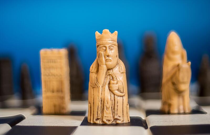 Lewis Chess pieces on chess board.