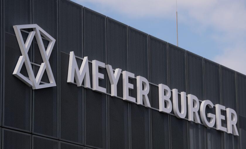Thalheim, Germany. 18th May, 2021. View of the entrance to the Swiss company Meyer Burger in Thalheim. The production of solar cells starts here with an annual nominal capacity of 400 megawatts. Saxony-Anhalt supports the company's production, according t