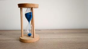 Hourglass or Sandglass. Catch the moment. Sands falling through hour glass. Pass of time and waste time concept.. Image shot 2019. Exact date unknown.