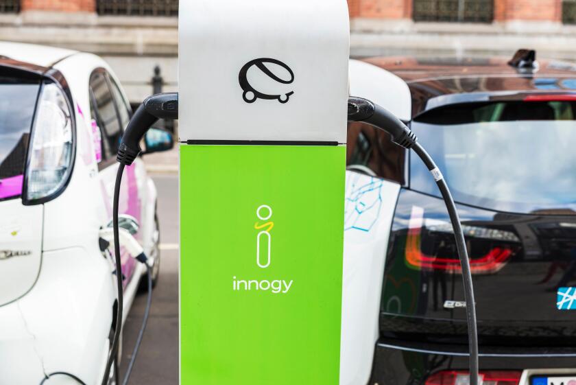 Berlin, Germany - April 14, 2017: Electric cars recharging batteries at a recharge point of the company Innogy in Berlin, Germany