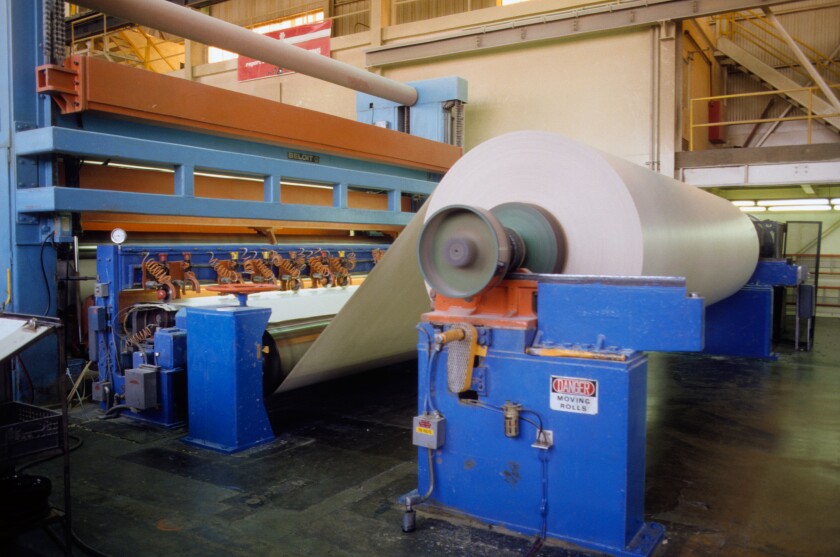 Used paper enters Smurfitt Paper company as waste, leaves as new paper eight hours later. Pomona, California USA