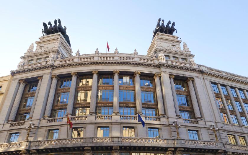 BBVA Bank building with Quadriga (Four Horse Chariot Sculptures) on top, Madrid, Spain, Alcala street, Madrid, Spain.