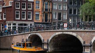 Amsterdam, The Netherlands - 21 June 2022: Old bridge in central Amsterdam