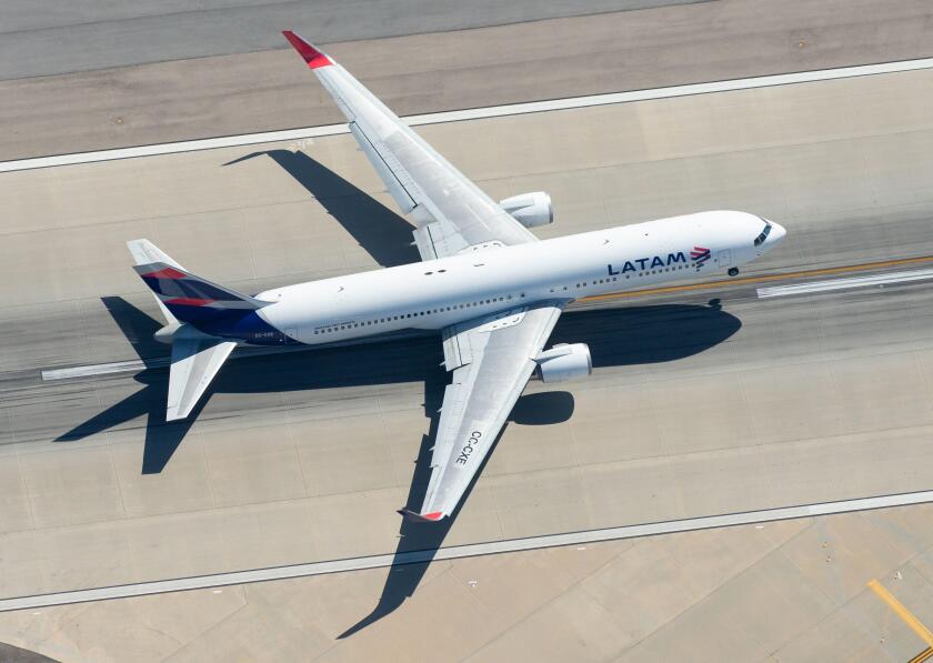 Aerial view of LATAM Airlines Boeing 767 CC-CXE departing LAX airport bound for Santiago (SCL), Chile. Widebody long haul aircraft seen from above.