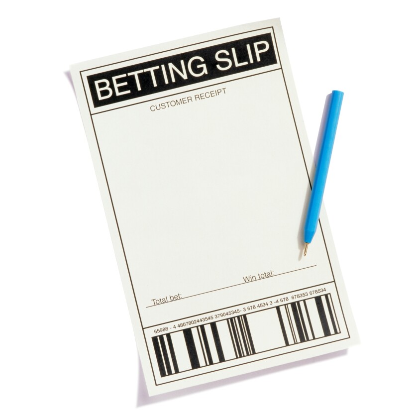 A betting slip and pen