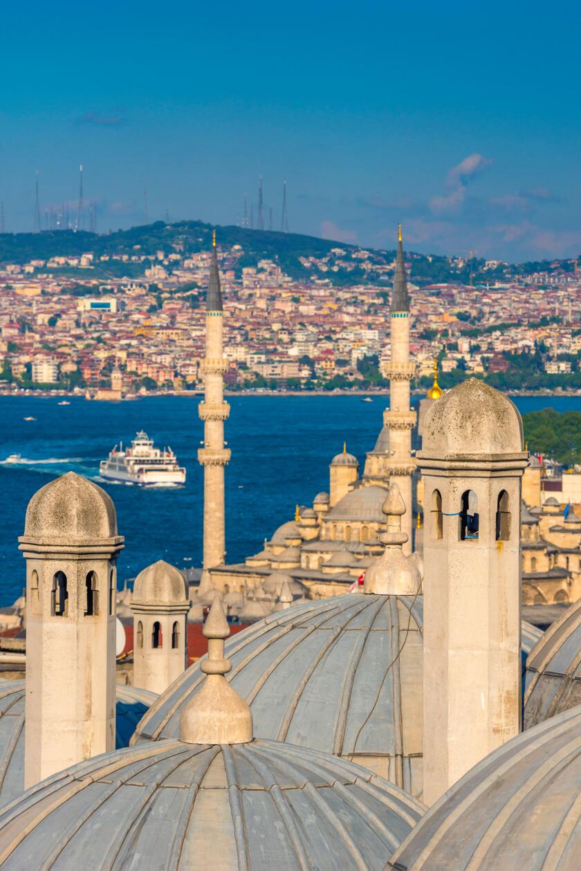 Turkey, Istanbul, Sultanahmet , domes of the Suleymaniye Mosque (Suleymaniye Camii) complex with New Mosque (Yeni Camii) beyond