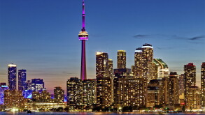 CN Tower dominates skyline of Harbourfront and Downtown Toronto, viewed from Wards Island.