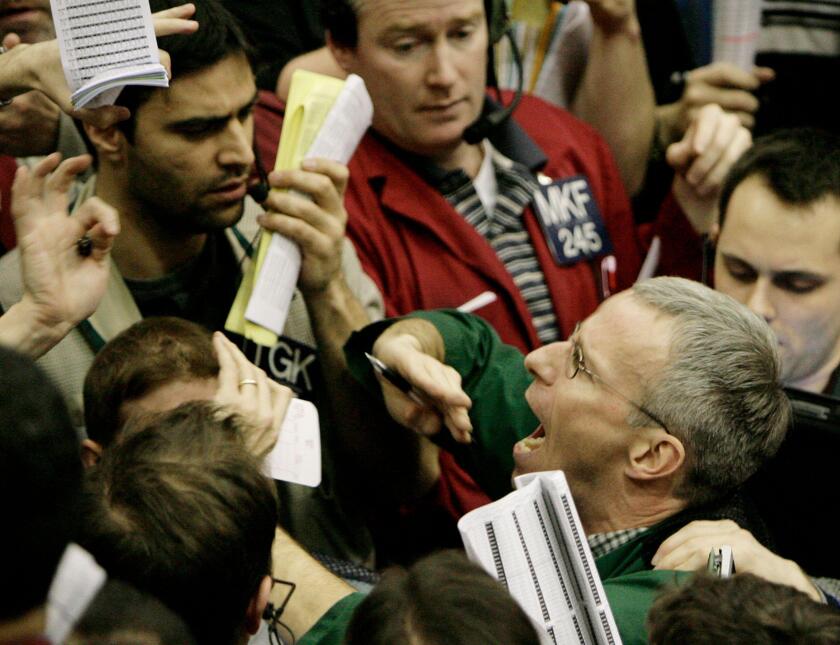 Traders shout in the Eurodollar options trading pit Wednesday, Jan. 30, 2008, at the Chicago Mercantile Exchange. Wall Street surged higher Wednesday after the Federal Reserve, confirming that there is increasing stress on the economy, cut interest rates 