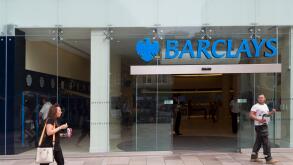 People outside Barclays bank one looking back at the other, Cardiff, Wales, UK